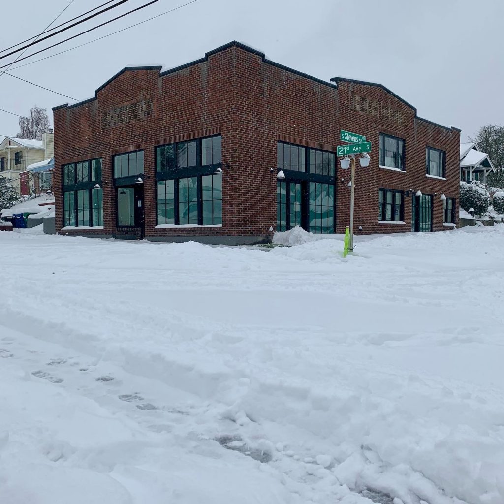 Street view of The Grocery exterior, in the snow. 